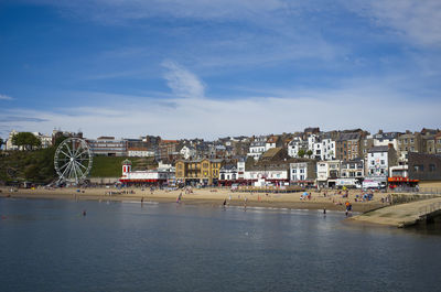 Scarborough town by sea against sky north yorkshire