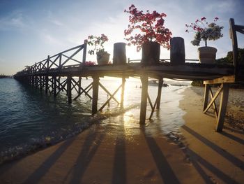 Pier over water against sky