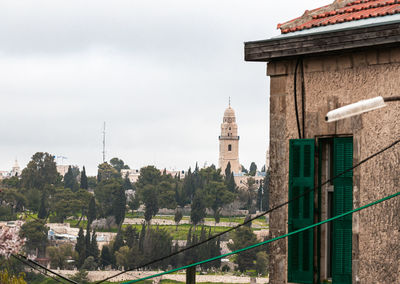 Panoramic view of buildings in city against sky