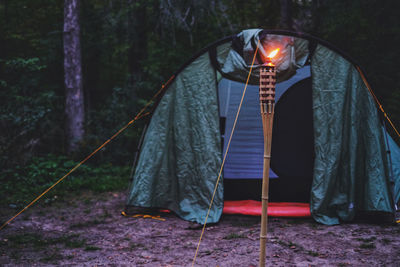 Portrait of woman standing in tent