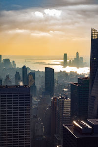 High angle view of buildings against sky during sunset