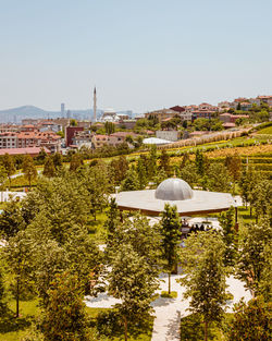 High angle view of trees and building against sky