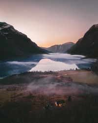 Scenic view of lake against sky during sunset