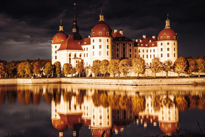 Reflection of building in water at night