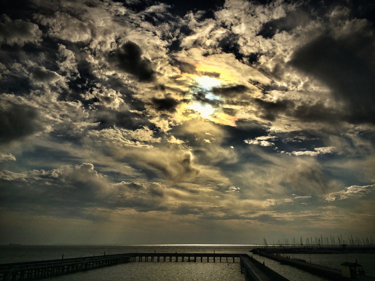 sea, sky, water, horizon over water, scenics, cloud - sky, tranquil scene, tranquility, beauty in nature, nature, cloudy, sunset, cloud, idyllic, beach, railing, outdoors, shore, weather, sunlight