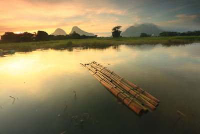 Scenic view of lake against sky during sunset