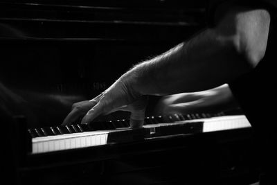 Cropped image of pianist playing piano