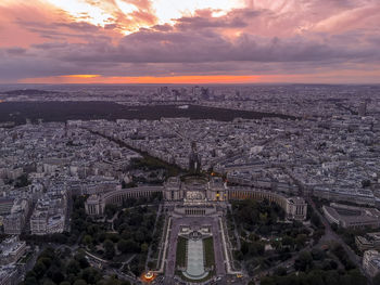 Aerial view of esplanade du trocadero against cloudy sky during sunset