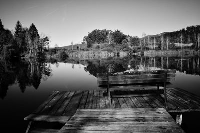 Pier on lake against sky