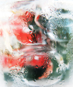 Close-up of condensed drinking glass