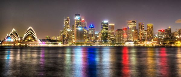 Illuminated city at waterfront