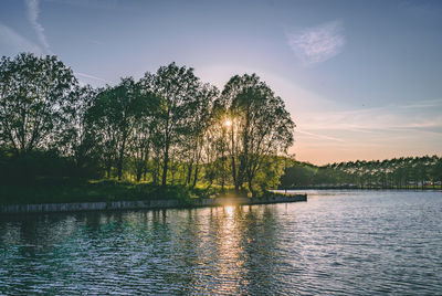 Scenic view of lake against sky during sunset