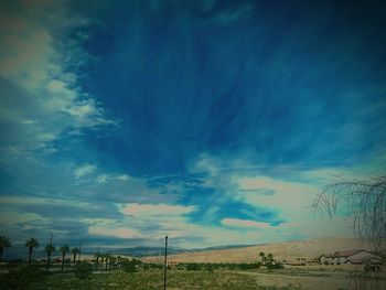 Scenic view of dramatic sky over landscape