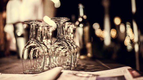 Close-up of wine glasses on table