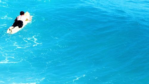 High angle view of man surfing in sea