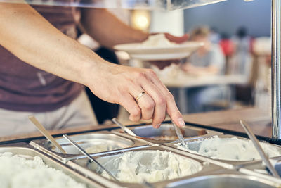 Midsection of chef preparing food in kitchen