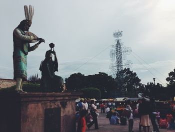 Woman standing against sky