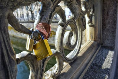 Close-up of padlocks on railing