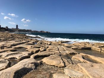 Scenic view of beach against sky