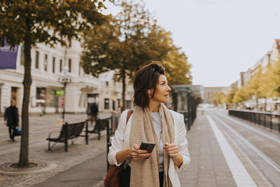 Smiling woman looking away