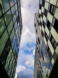 Low angle view of modern buildings against sky