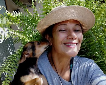 Portrait of smiling young woman in hat