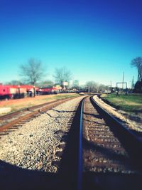 Railway tracks against clear sky