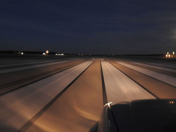 View of airport runway at night