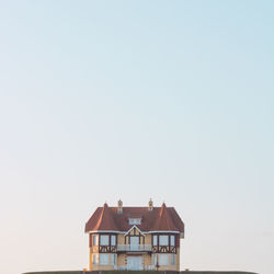 Houses against clear sky