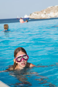 Portrait of girl in infinity pool