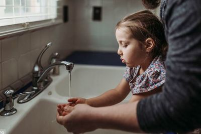 Close-up of girl in bathroom at home