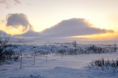 Scenic view of landscape against sky during winter