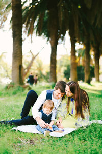 Couple sitting on tree