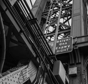 Low angle view of text on bridge