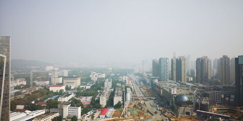High angle view of buildings in city against clear sky
