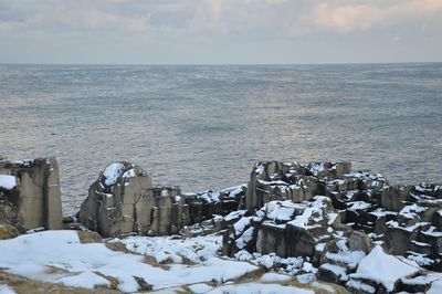 Scenic view of sea against sky during winter