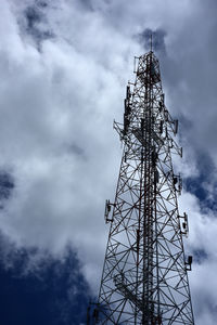 Low angle view of communications tower against sky