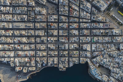 Italy, puglia, polignano a mare, aerial view of grid pattern of coastal old town