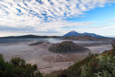 View of landscape against cloudy sky