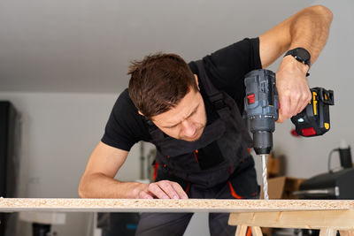 Close-up of man working at home