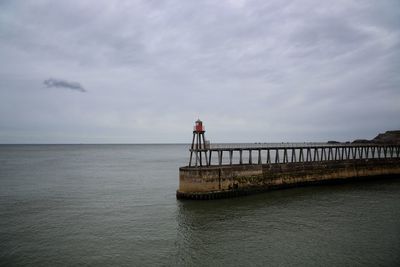 Pier over sea against sky