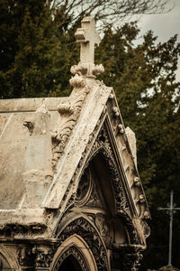 Low angle view of sculpture against temple