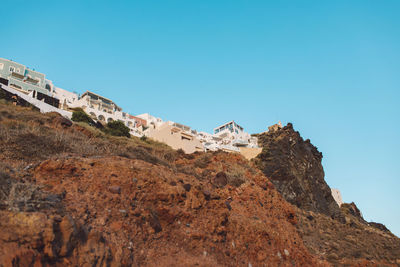 Low angle view of mountain against clear blue sky