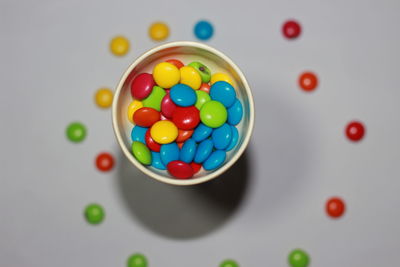 High angle view of multi colored candies on table