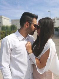 Young couple standing outdoors