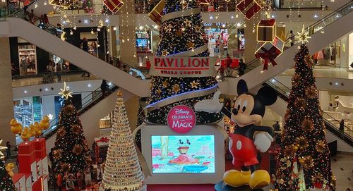 Christmas decorations hanging in market for sale