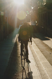 Man with bicycle on street