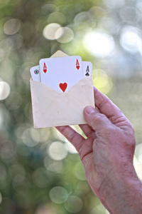 Close-up of hand holding heart shape