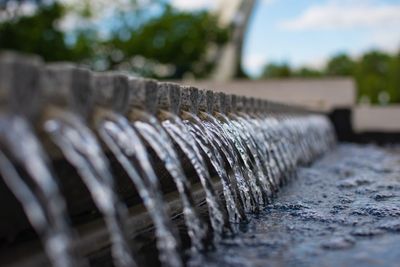 Close-up of water flowing from wood