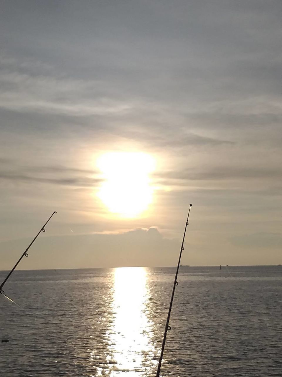 water, sky, sunset, beauty in nature, sun, sea, scenics - nature, tranquility, tranquil scene, horizon over water, horizon, rod, reflection, sunlight, fishing rod, fishing, nature, cloud - sky, waterfront, no people, outdoors, bright